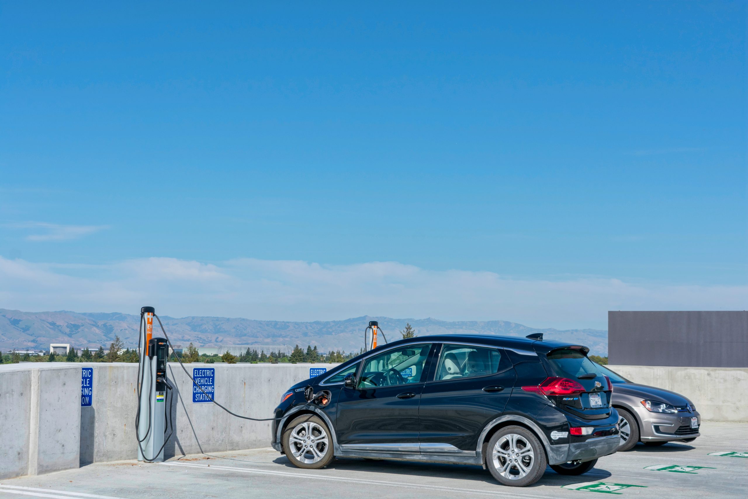 Electric,Vehicle,Charging,Station,On,The,Roof,Of,Parking,Garage